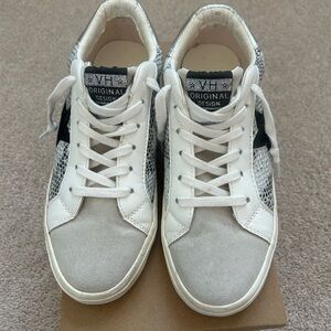 White and Gray Sneakers with Black Accents